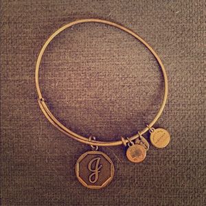 Gold J Alex and Ani bracelet